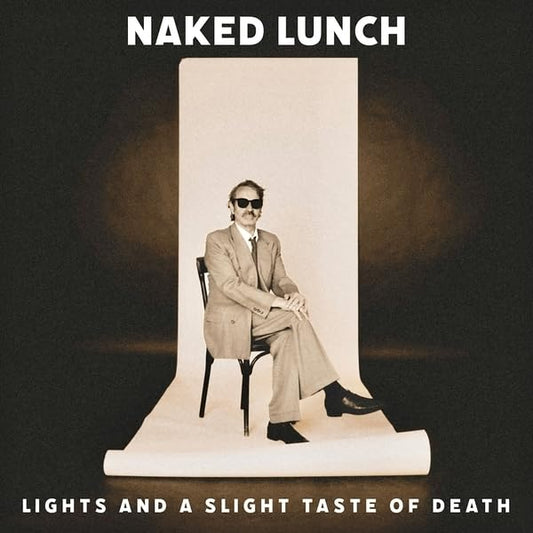 Album cover for Naked Lunch’s “Lights” featuring a seated man in a suit.