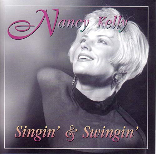 Nancy Kelly album cover, portrait of a smiling woman in evening wear.