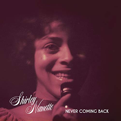 Vinyl album cover with a woman holding a microphone and smiling.