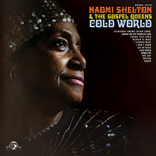 "Album cover featuring a woman with beaded headpiece and top against a dark background."