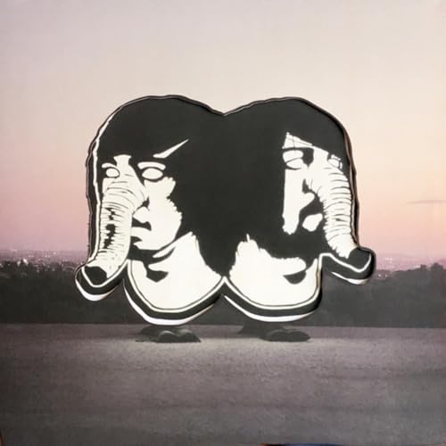 Black and white elephant-shaped vinyl record against a pink and grey sky.