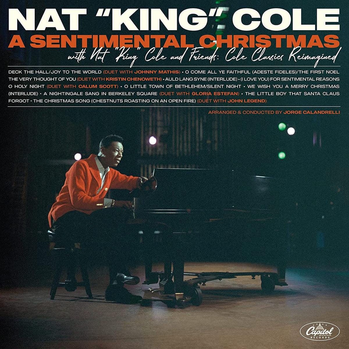 Nat King Cole album cover featuring Cole at a piano, red and green text.