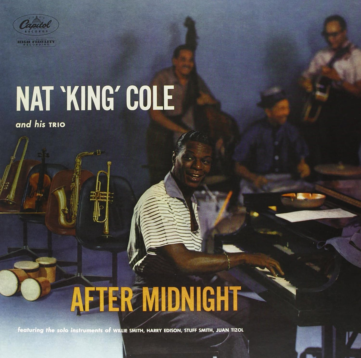 Nat King Cole at a piano with his trio, album cover art.