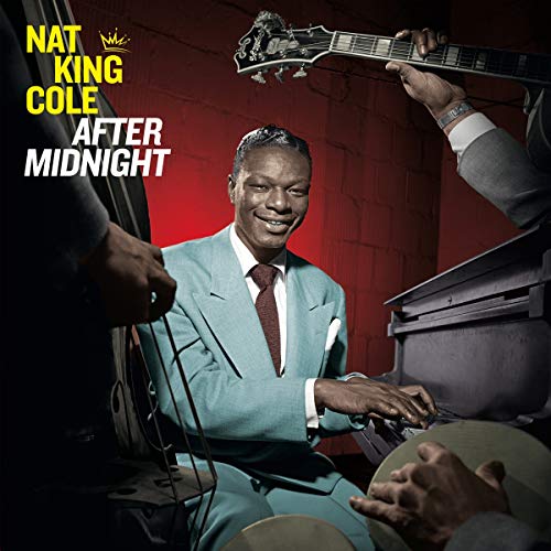 Nat King Cole album cover featuring a smiling Cole with musicians.