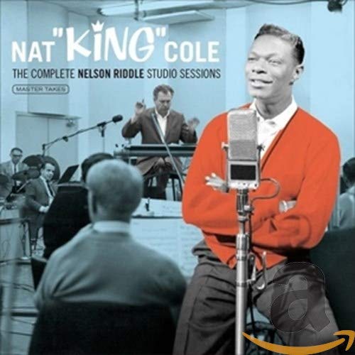 Nat King Cole at a microphone in a recording studio, vintage style.