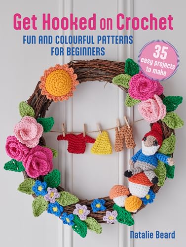 Crochet book cover featuring a wreath with crocheted flowers and figures.