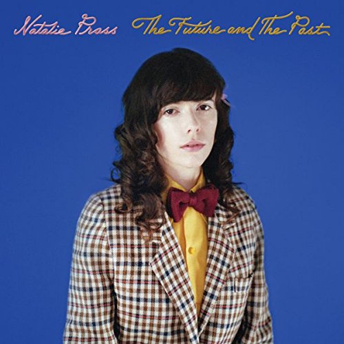 Vinyl album cover featuring a woman in a plaid jacket against a blue background.