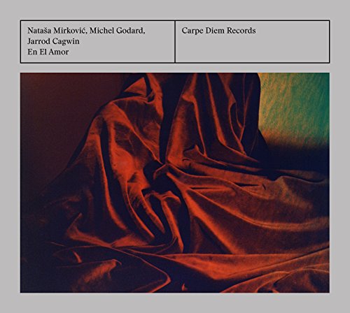 The image is a CD cover featuring a red fabric, likely for "Natasa Mirkovic - Mirkovic: En El Amor".