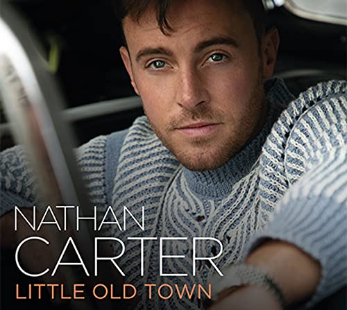 CD cover featuring Nathan Carter, wearing a striped sweater, looking at the viewer.