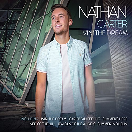 "Album cover featuring Nathan Carter, a man in a light blue shirt, against a modern building."
