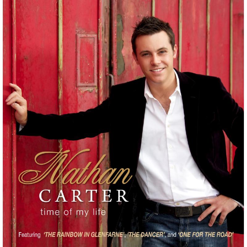 Nathan Carter album cover: smiling man in a blazer leaning against a red door.
