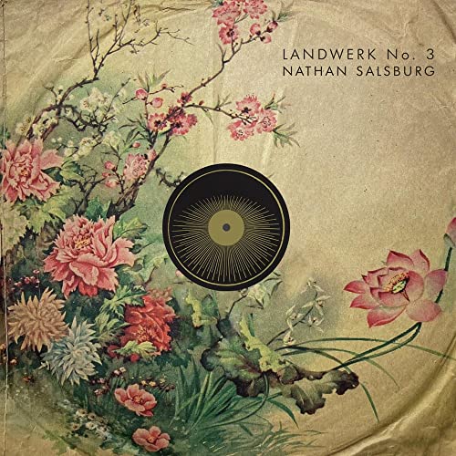 Album cover with vintage floral art and a central black sunburst vinyl record icon.