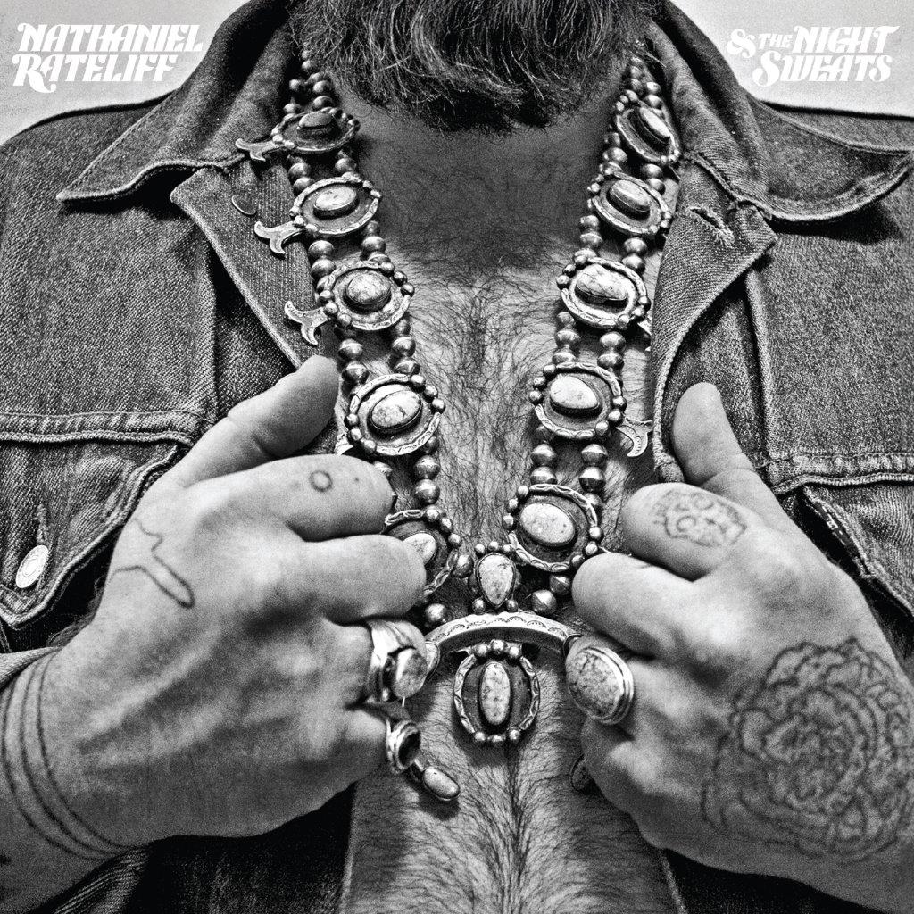 Black and white album cover featuring a man with tattoos and jewelry.