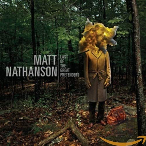 CD cover: Man in suit with exploding head in a forest.