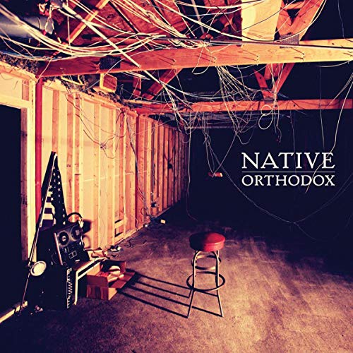 Album cover: dimly lit room with stool, guitar, and exposed wiring.
