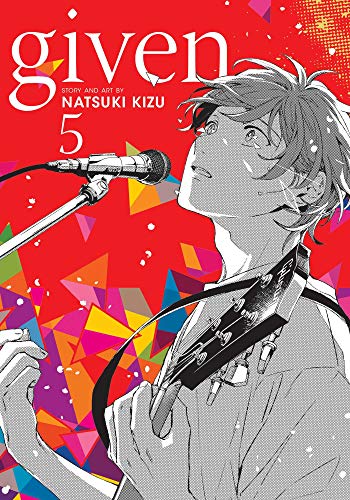 Manga cover featuring a young man singing into a microphone while holding a guitar.
