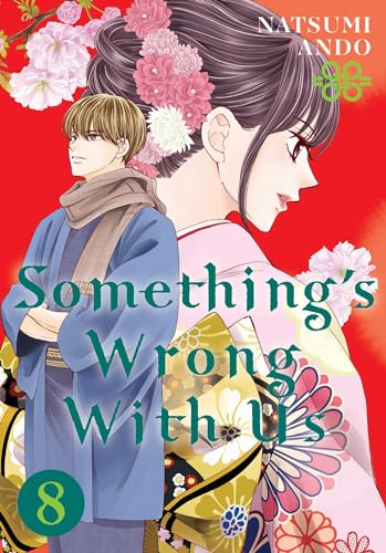 Manga volume cover with two characters amidst floral designs.