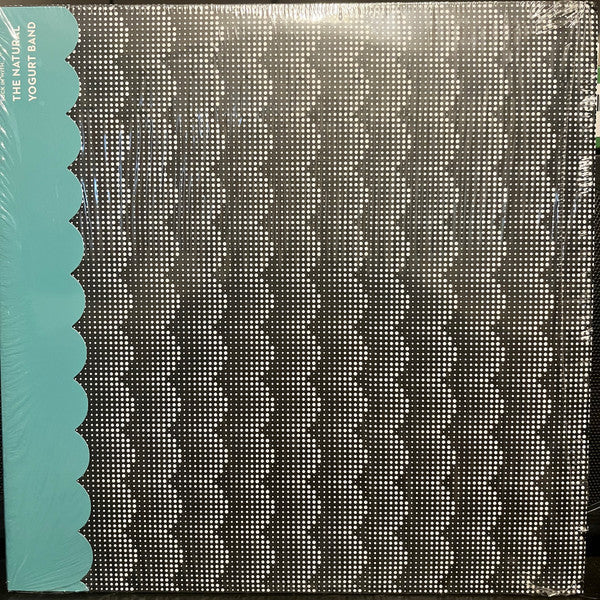Vinyl record cover with a textured black and teal design.