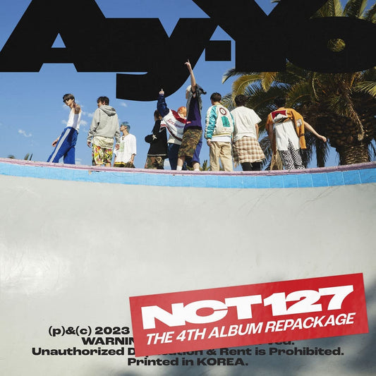 K-pop group NCT 127 album cover with eight members standing on a wall.