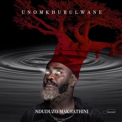 CD cover: Man looking up, with a red tree and figure silhouette.