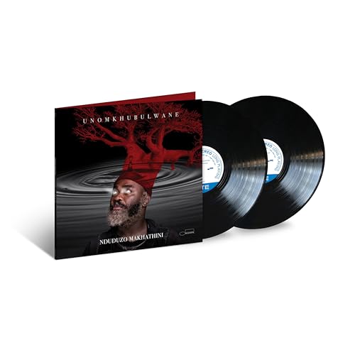Vinyl record set with album cover featuring a man and red tree.