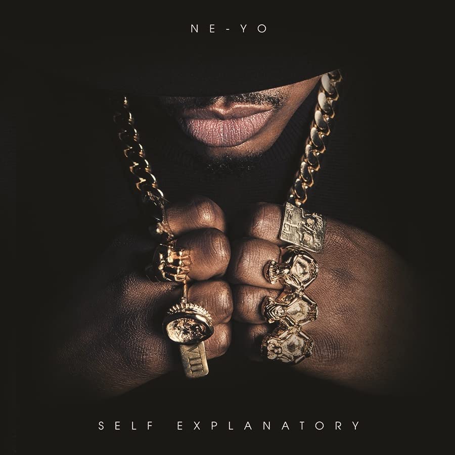 Ne-Yo album cover: close-up of artist with jewelry, dark background.