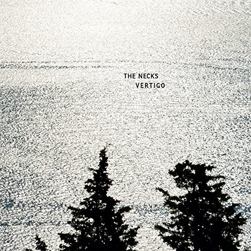 Album cover for The Necks’ “Vertigo” with textured light and trees.