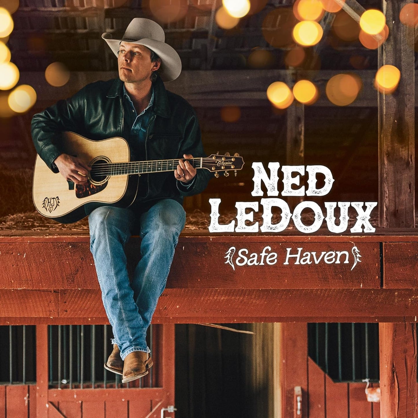 Ned Ledoux album cover: man with guitar, rustic barn background.