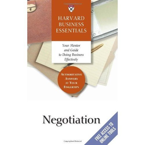 Book cover for "Negotiation" by Harvard Business Essentials, with office supplies.