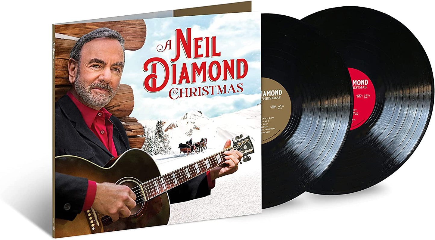 Neil Diamond holding a guitar, with a snowy landscape and horse-drawn sleigh.