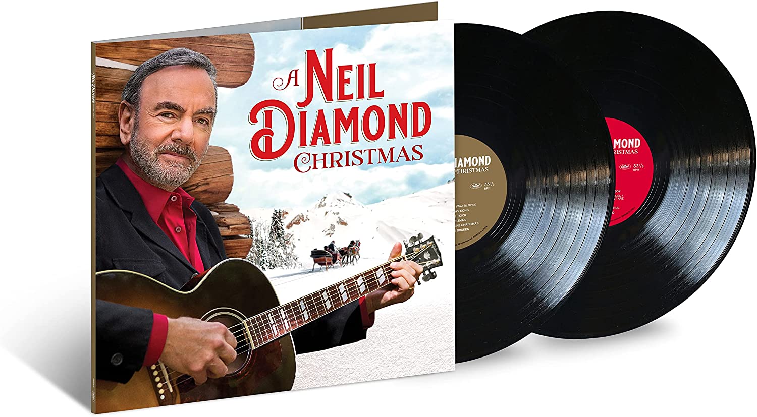 Neil Diamond holding a guitar, with a snowy landscape and horse-drawn sleigh.