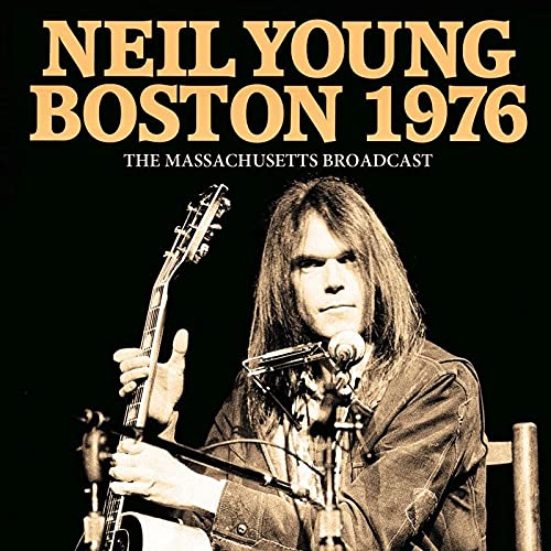 Neil Young album cover: black background with artist portrait and guitar.