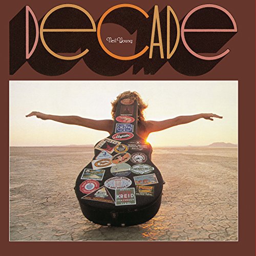 Neil Young’s “Decade” vinyl album cover: a guitar in a desert landscape.