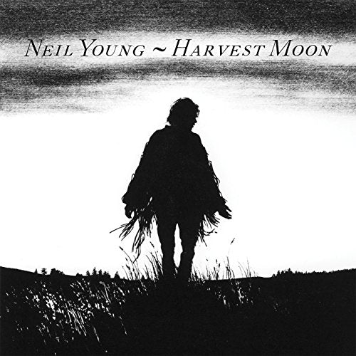 Neil Young’s “Harvest Moon” vinyl album cover, silhouetted figure in a field.