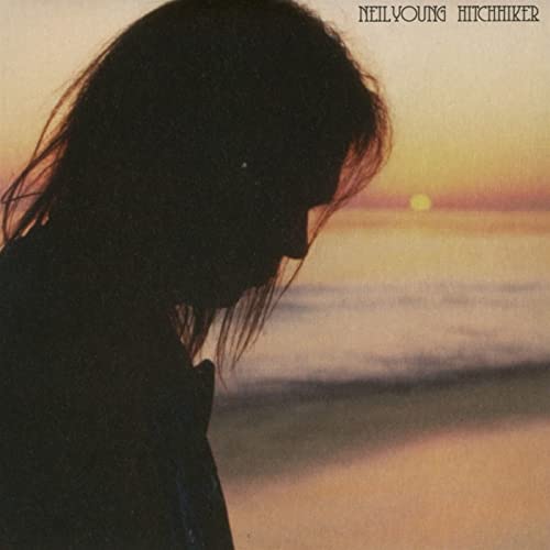 Silhouette of a person against a sunset background, titled "Neil Young - Hitchhiker".