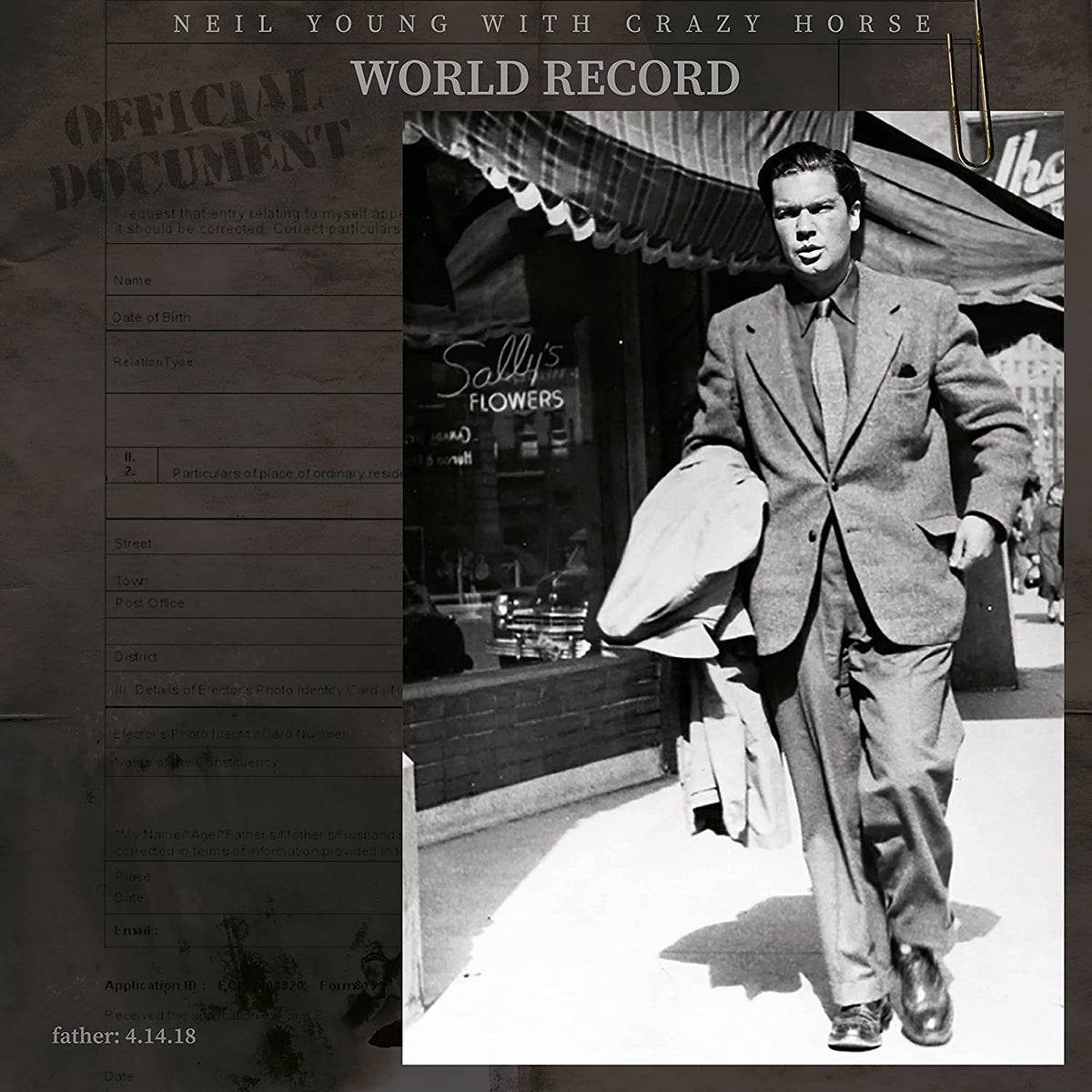 Vinyl cover showing a man in a suit walking past Sally's Flowers shop.