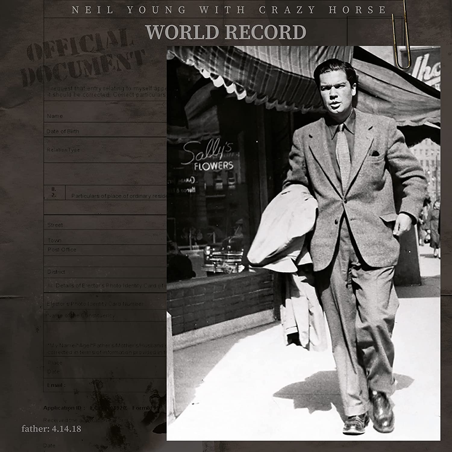 Vinyl cover showing a man in a suit walking past Sally's Flowers shop.