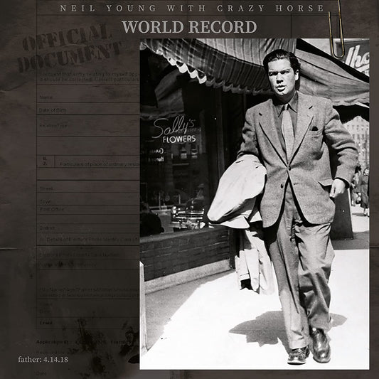 Vinyl cover showing a man in a suit walking past Sally's Flowers shop.