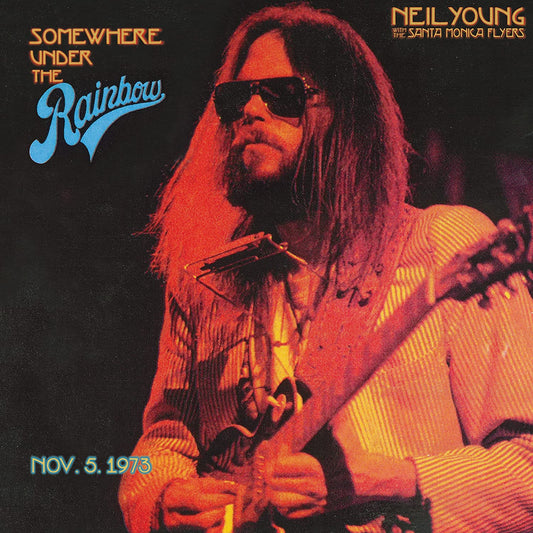 "Album cover featuring Neil Young playing guitar, with title and date."