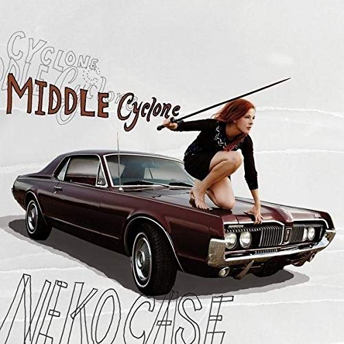 Neko Case album cover featuring a woman with a car and sword.