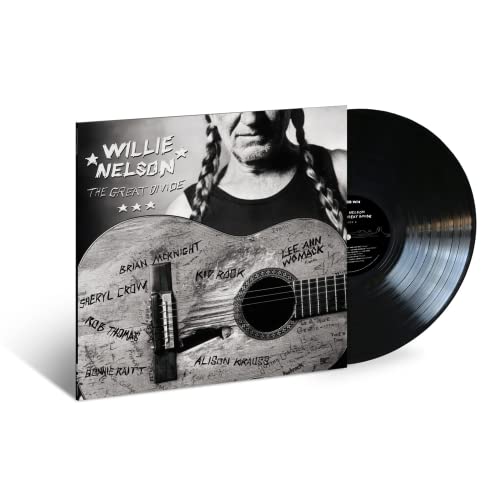 Willie Nelson album cover and vinyl record with signatures on guitar.