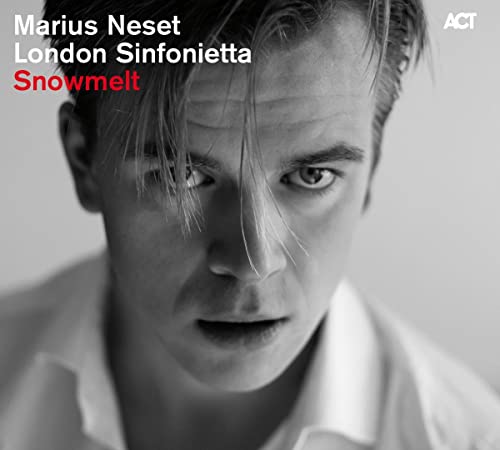 Black and white portrait of Marius Neset with album title text overlay.
