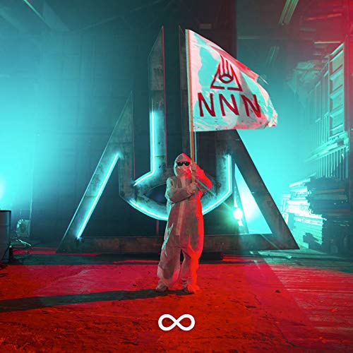 Person in white hazmat suit holding a flag with "NNN" in a dimly lit warehouse.