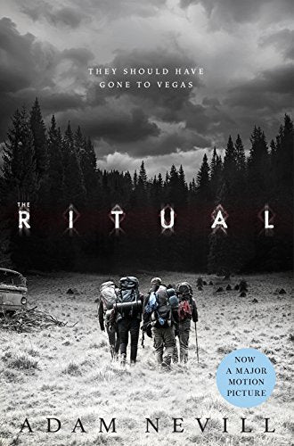 Book cover: hikers walking towards a dark, dense forest.