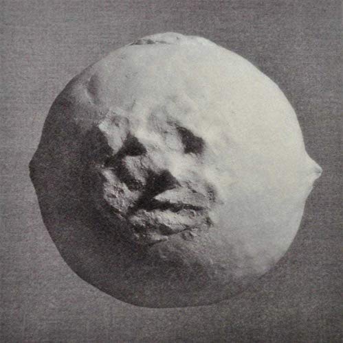Black and white CD cover with a distorted, sculpted face.
