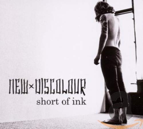 CD cover: back view of tattooed man, black and white aesthetic.