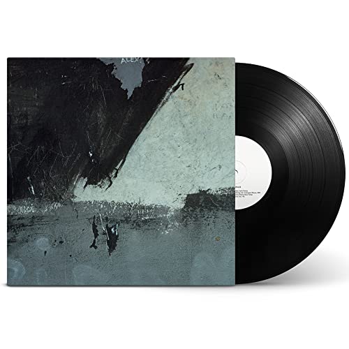 New Order’s “Shellshock” vinyl record with abstract, textured grey cover art.