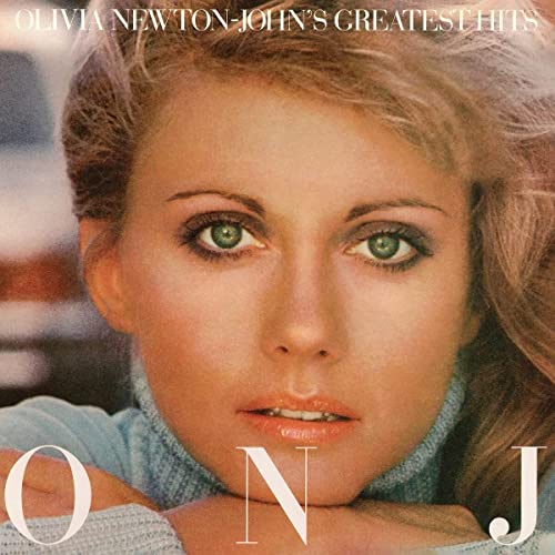 Olivia Newton-John’s “Greatest Hits” vinyl record cover featuring her portrait.