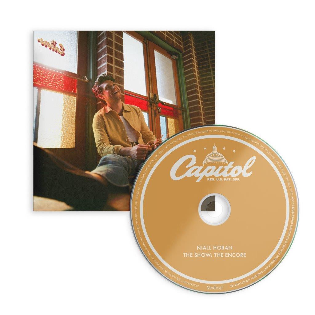 Niall Horan CD cover: artist seated on steps with a building backdrop.