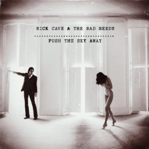 A vinyl record cover featuring a man and nude woman in a white room.